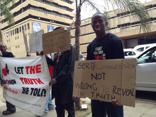 Right2Know protesters outside the Department of Justice and Constitutional Development in Pretoria call for the Seriti Commission to be scrapped. Picture: Amanda Watson 